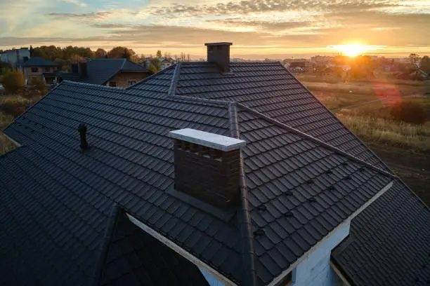 Aerial view of a tiled roof at sunset