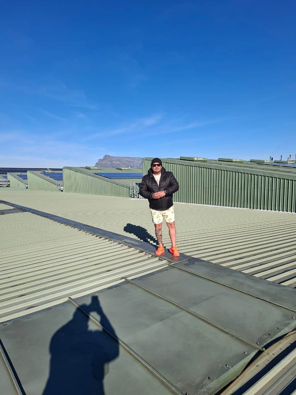 Superior Waterproofing team member on a large commercial roof waterproofing project